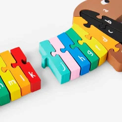 Puzzle in legno dell'alfabeto del cane salsiccia