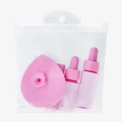 Set da viaggio rosa con flaconi dosatori - 4 pz
